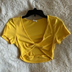 Yellow crop top with a twist detail